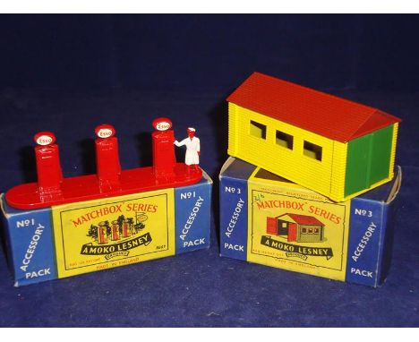 A pair of Matchbox Accessory Packs comprising a No 1 Esso Petrol Pump Set and a No 3 Garage.  VG-E in G-VG boxes.