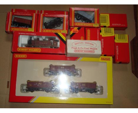 A group of Hornby OO Gauge rolling stock to include an engine, some wagons and some boxed hydraulic buffer stops. G in G boxe