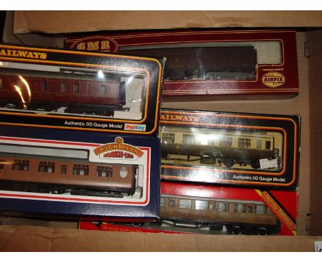 A mixed group of boxed coaches by Airfix, Mainline, Hornby and Bachmann.  G in G boxes. (5)