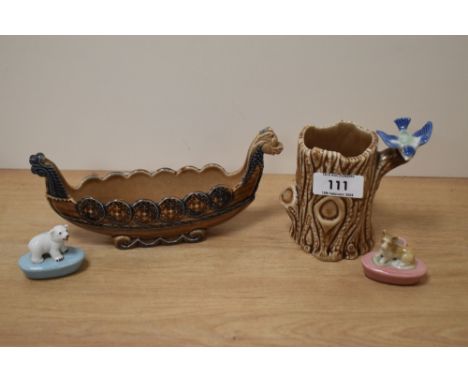 A wade Viking ship and tree trunk spill vase with bluebird and two Wade pencil holders, one with dog and one with polar bear.