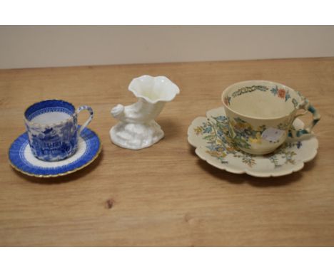 A Victorian Copeland blue and white teacup and saucer, of scalloped form, a Royal Worcester cornucopia vase, and another teac