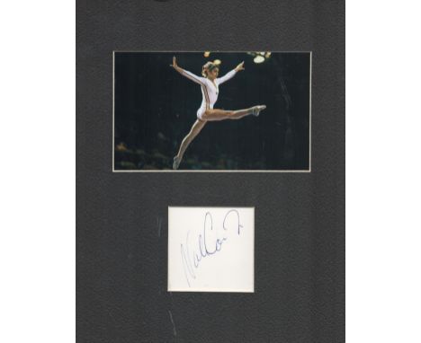Nadia Comaneci 10x8 mounted signature piece includes signed album page and colour photo of the Olympic legend in action. Nadi