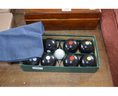 A boxed set of carpet bowls