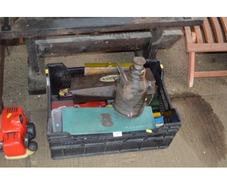 A plastic crate of various hand tools