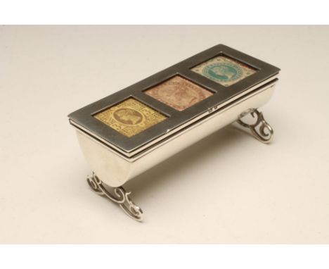 A LATE VICTORIAN SILVER TRIPLE STAMP BOX, maker possibly L. Emanuel, Birmingham 1898, of oblong form raised upon scroll trest