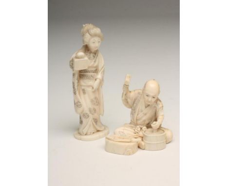 A JAPANESE ONE PIECE IVORY FIGURE, Meiji period, carved as a box maker, seated cross legged, holding aloft a hammer in his ri