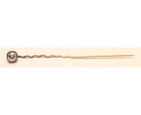 A DIAMOND STICK PIN, the cushion cut stone close back collet set to a wavy pin  (Est. plus 21% premium inc. VAT)