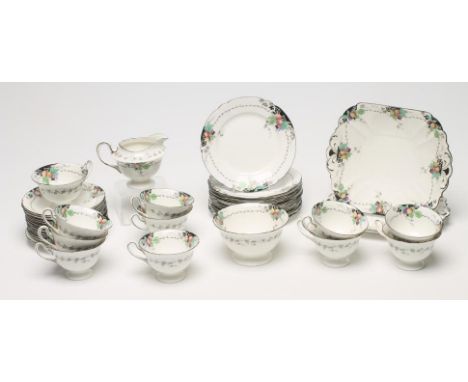 A SHELLEY CHINA TEA SERVICE, 1930's, printed in black and overpainted in colours with plums, apples and pears, comprising twe