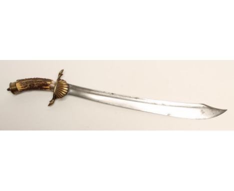 A GERMAN HUNTING SWORD, the 18" clip point blade etched with foliate scrolls and stamped TJI-K-R- and -1917-, with brass shel