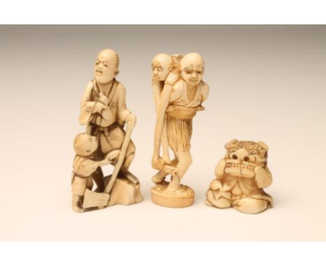 TWO JAPANESE IVORY SMALL FIGURES, c.1900, one carved as Ashinaga wading through water with Tenaga on his shoulders holding a 