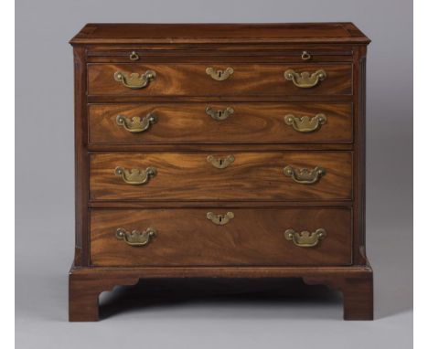 A SMALL GEORGIAN MAHOGANY CHEST, late 18th century, the moulded edged and banded top with stringing, brushing slide below ove