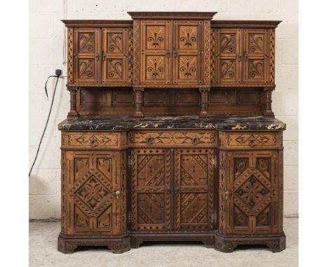 A VICTORIAN AESTHETIC OAK SIDE CABINET, possibly designed by Charles Bevan for Marsh Jones &amp; Cribb, of breakfront form wi