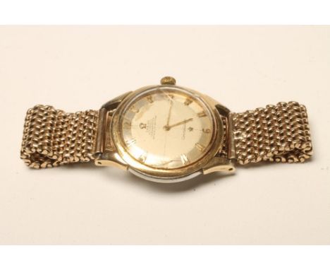 AN OMEGA AUTOMATIC CONSTELLATION CHRONOMETER, the champagne dial with applied gilt metal Arabic quarter numerals, the (now ba