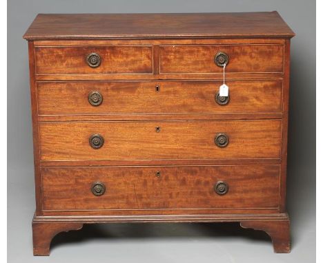 A GEORGE III MAHOGANY CHEST, late 18th century, the finely moulded edged top over two short and three long drawers with brass
