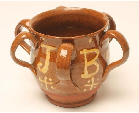 A DOCUMENTARY SLIPWARE VESSEL, 1836, of baluster form with six applied loop handles, trailed in yellow with the date and init