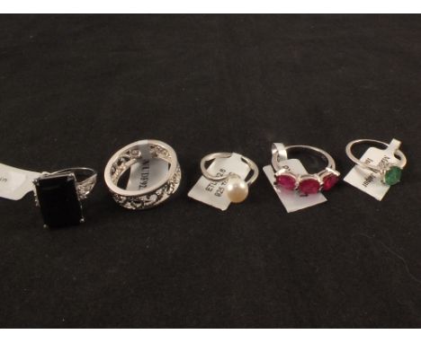 A group of five silver stone set rings including ruby, spinel and pearl etc