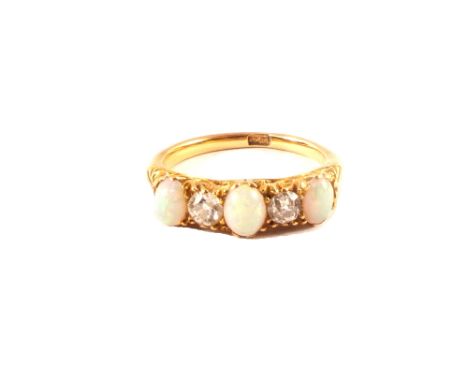 An 18ct gold opal and diamond ring, size K