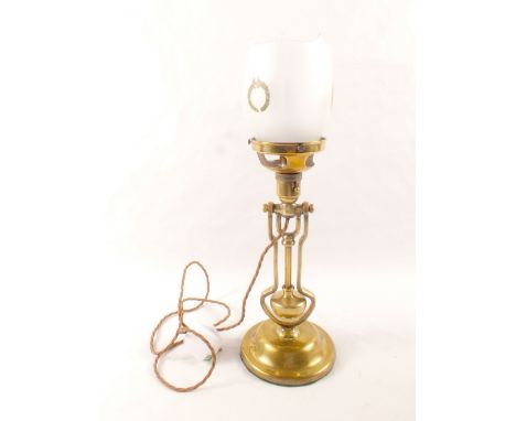 A brass gimbal lamp stamped Playmit AP9009