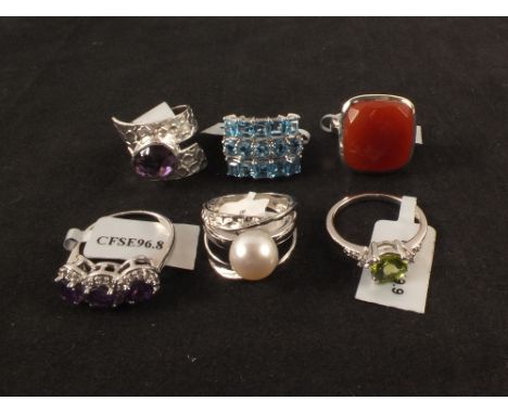 Six silver stone set rings including topaz, amethyst, pearl etc