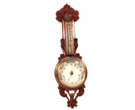 An aneroid barometer in carved oak case, signed Benetfink & Co