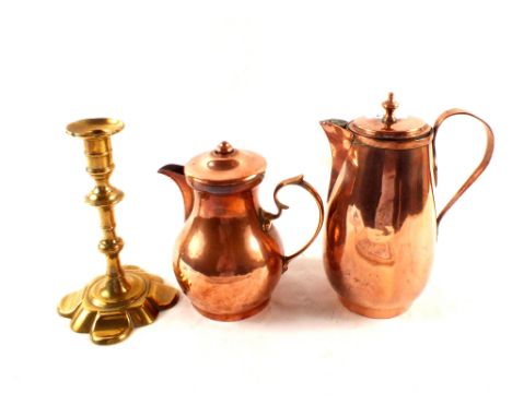 An antique petal base brass candlestick plus two 19th Century copper coffee pots