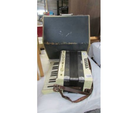 A cased Ludwig 'The Antoria' accordion.