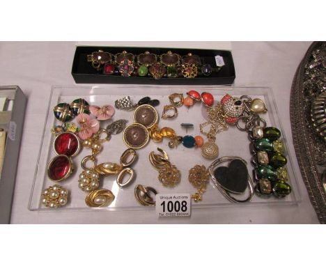 A collection of vintage earrings including Monet, 20 pairs for pierced ears, 15 clip on and 3 bracelets etc.,
