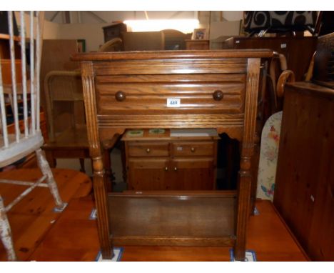 A medium oak wall table with drawer and under shelf, height 72cm, width at widest 80cm approx.