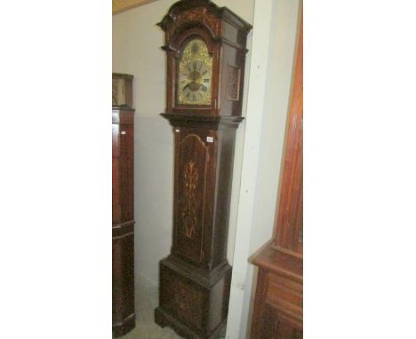 A mahogany cased 8 day brass dial Grandfather clock with inlaid door and base. ****Condition report**** It is on 3 springs. I