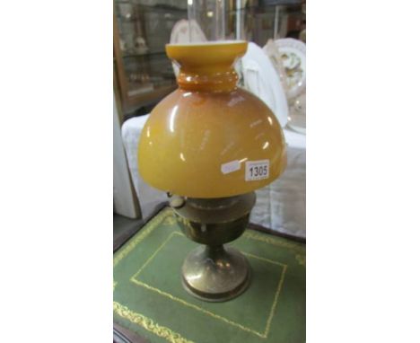 A brass Aladdin oil lamp.