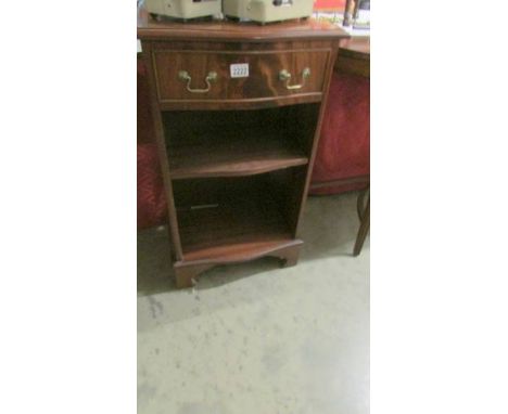 A single drawer mahogany book shelf.