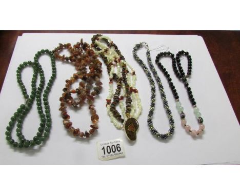 A Tigers eye and mother of pearl necklace with a heart design clasp, together with an agate necklace, a haNd painted vintage 