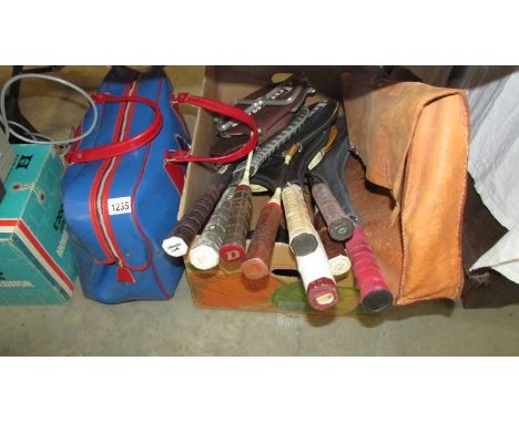 A good lot of tennis rackets including Dunlop, Slazenger etc.,  together with a vintage holdall from the 1980's England World