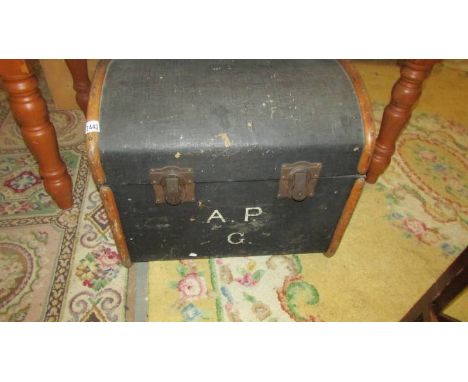 A domed top cabin trunk.