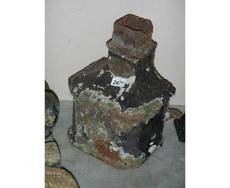 A cast iron water hopper.