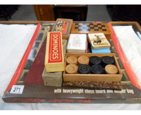 A boxed chess set (sealed in package) small chess set in box and 1 other chess set as well as 2 packs dominoes (1 box missing