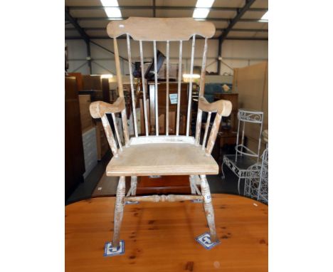 A vintage high stick back Windsor style arm chair