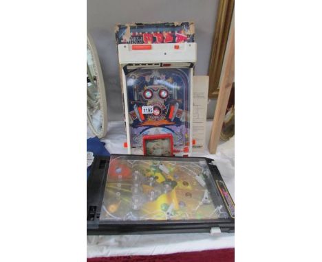A vintage boxed Atomic Arcade pinball machine (box a/f), one other (both come with one ball each) and a Pandsnag puzzle.