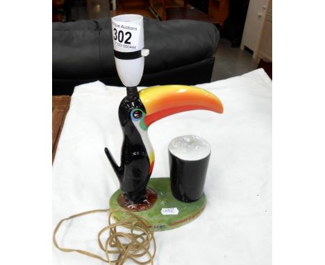 A Carlton Ware Guinness Toucan table lamp, base damaged and repaired, needs re-wiring