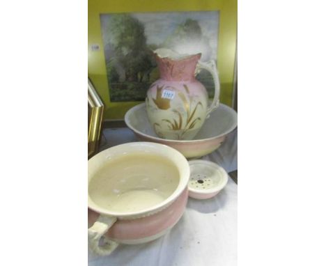 A jug and basin set (basin has crack), a chamber pot a/f and a soap dish.