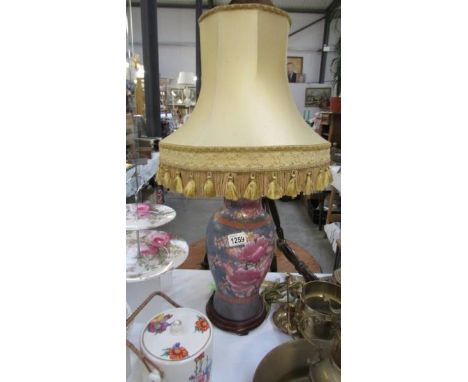 An oriental style table lamp with shade.