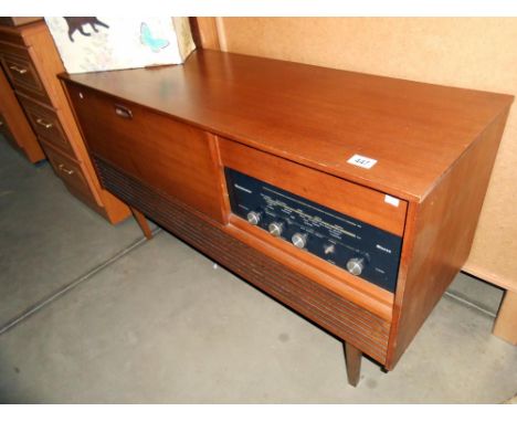 A retro teak effect Westminster record player radio radiogramme, height 66cm, length 117cm approx.