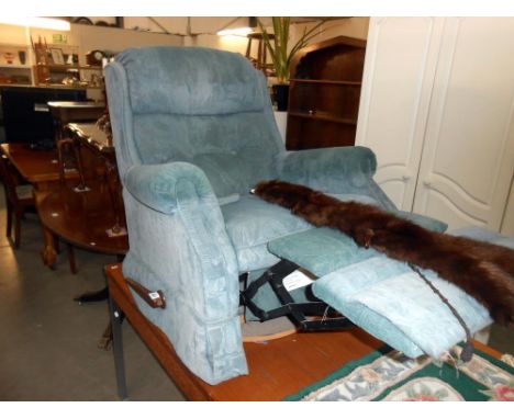 A green/blue fabric manual recliner arm chair