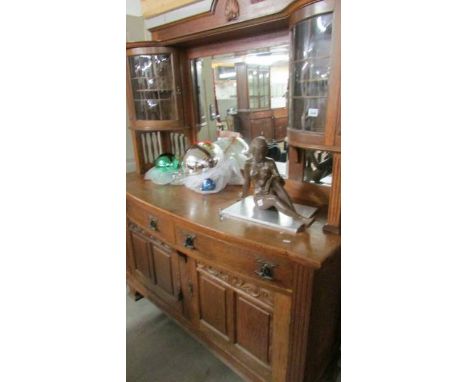 A good quality oak mirror backed sideboard with top side cabinets. ****Condition report**** Mirrors & glazed door panels, no 