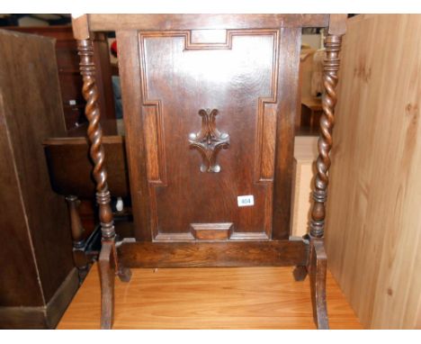 A 1930's oak firescreen height 81cm, width 57cm approx.