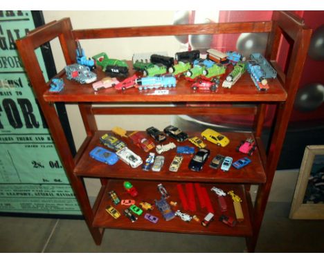 3 shelves of diecast including Matchbox, Ertl Thomas the Tank Engine etc.