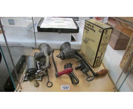 A quantity of vintage kitchenalia including cast iron mincers, bull head can opener etc.,