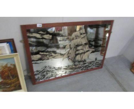 A large framed mirror tile picture of a galleon in rough seas, image 91 x 61 cm, framed 99 x 69 cm, collect only.