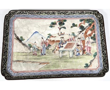 A Chinese enamelled rectangular tray dish with scholars around tables in mountain, scrolling border, flower mark to underside