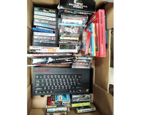 A vintage Sinclair ZX Spectrum + computer and a good selection of various games etc 